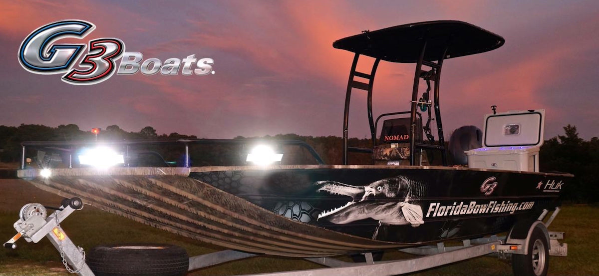 Florida Bowfishing Charter Boat with lights on.